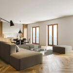 Un soggiorno con porte finestre in legno-alluminio